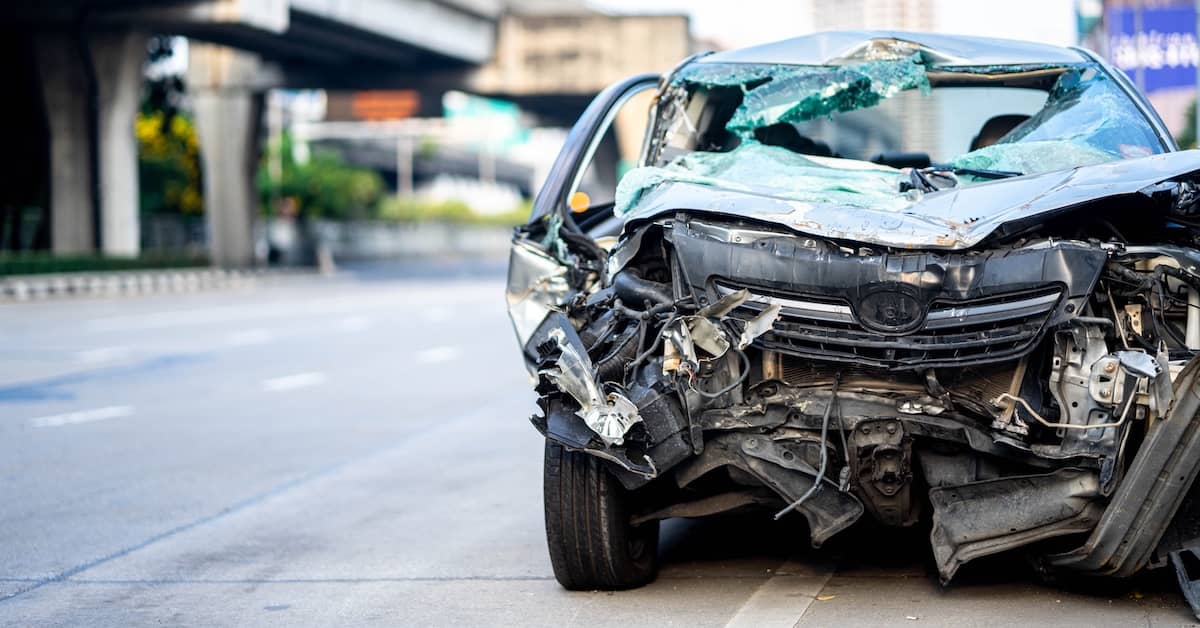 Front end of a badly damaged car after a fatal crash | Bernheim Kelley Injury Lawyers