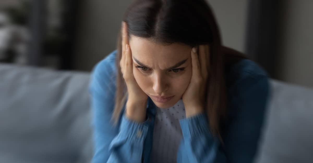 Stressed woman. | Bernheim Kelley Injury Lawyers