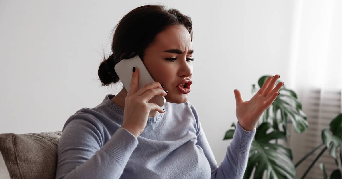 Frustrated woman on phone. | Bernheim Kelley