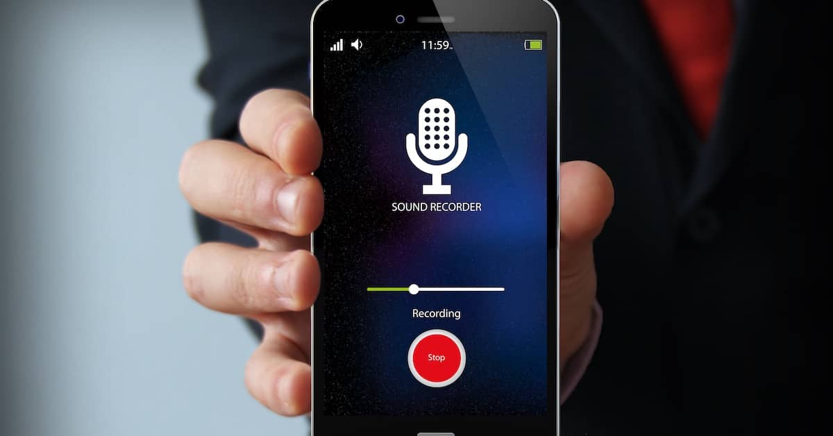 Hand holding cell phone that's voice recording. | Bernheim Kelley Injury Lawyers