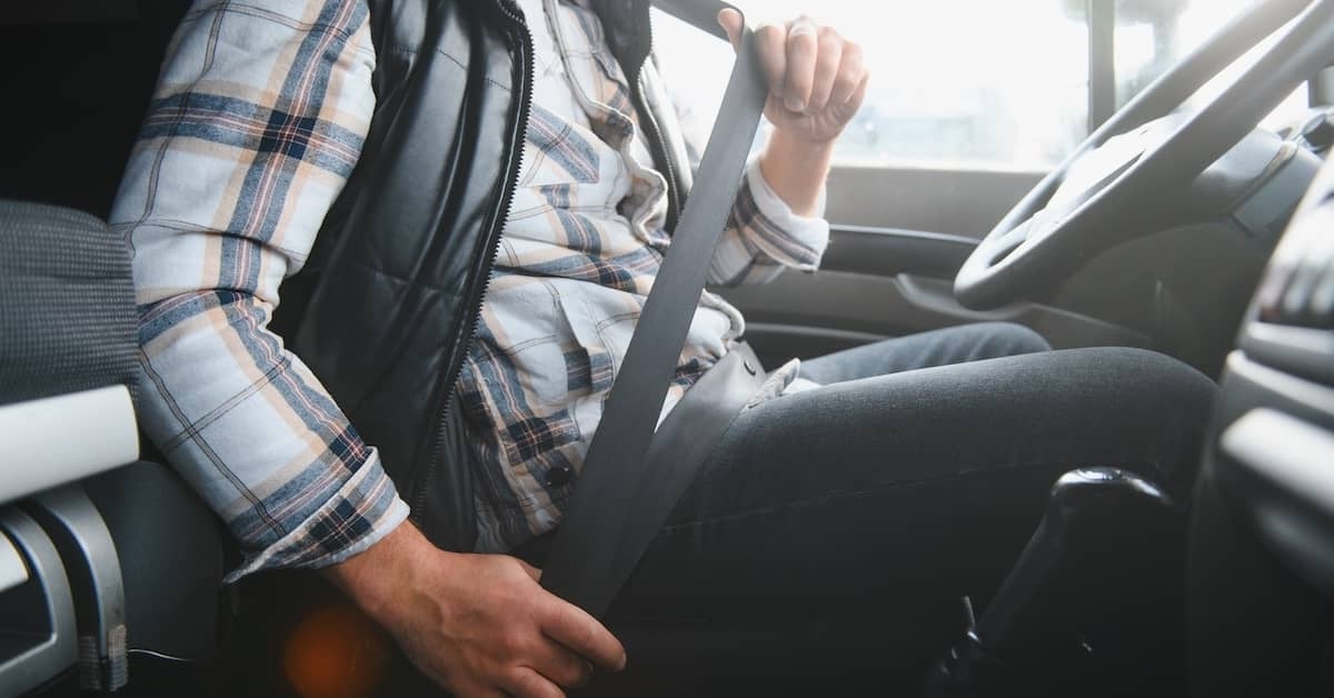 Working driver buckles seatbelt. | Bernheim Kelley Injury Lawyers